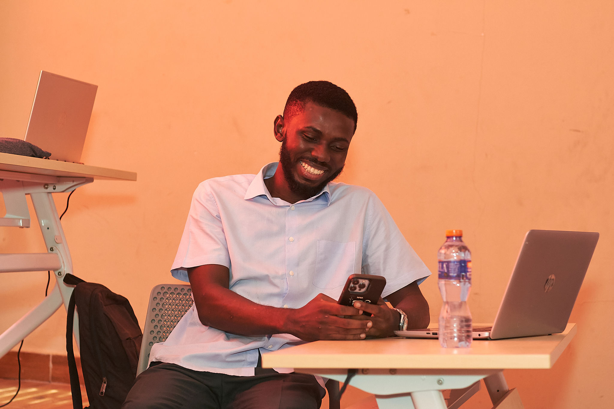 Mentor providing guidance to students during a workshop